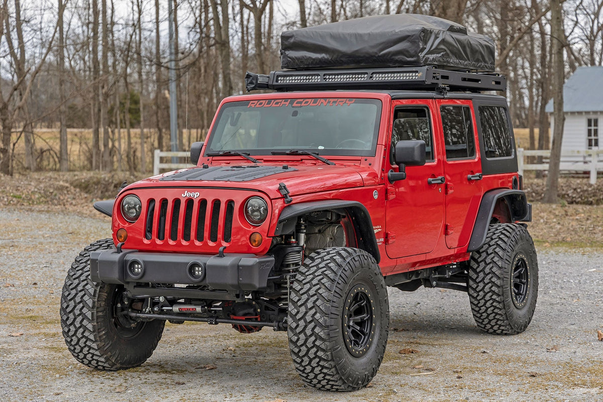 Red Jeep Wrangler with roof top tent